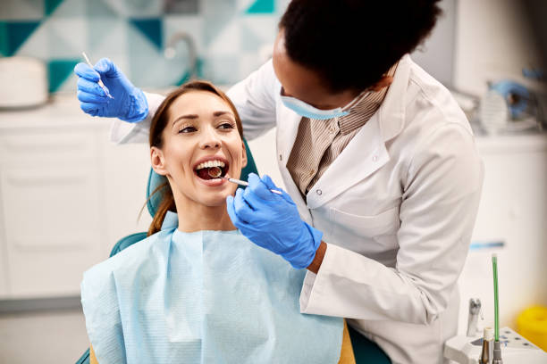 dentist checking her client's teeth
